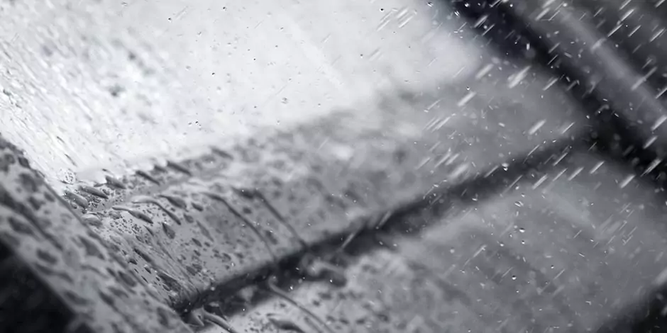 Rain falling on a VELUX roof access window